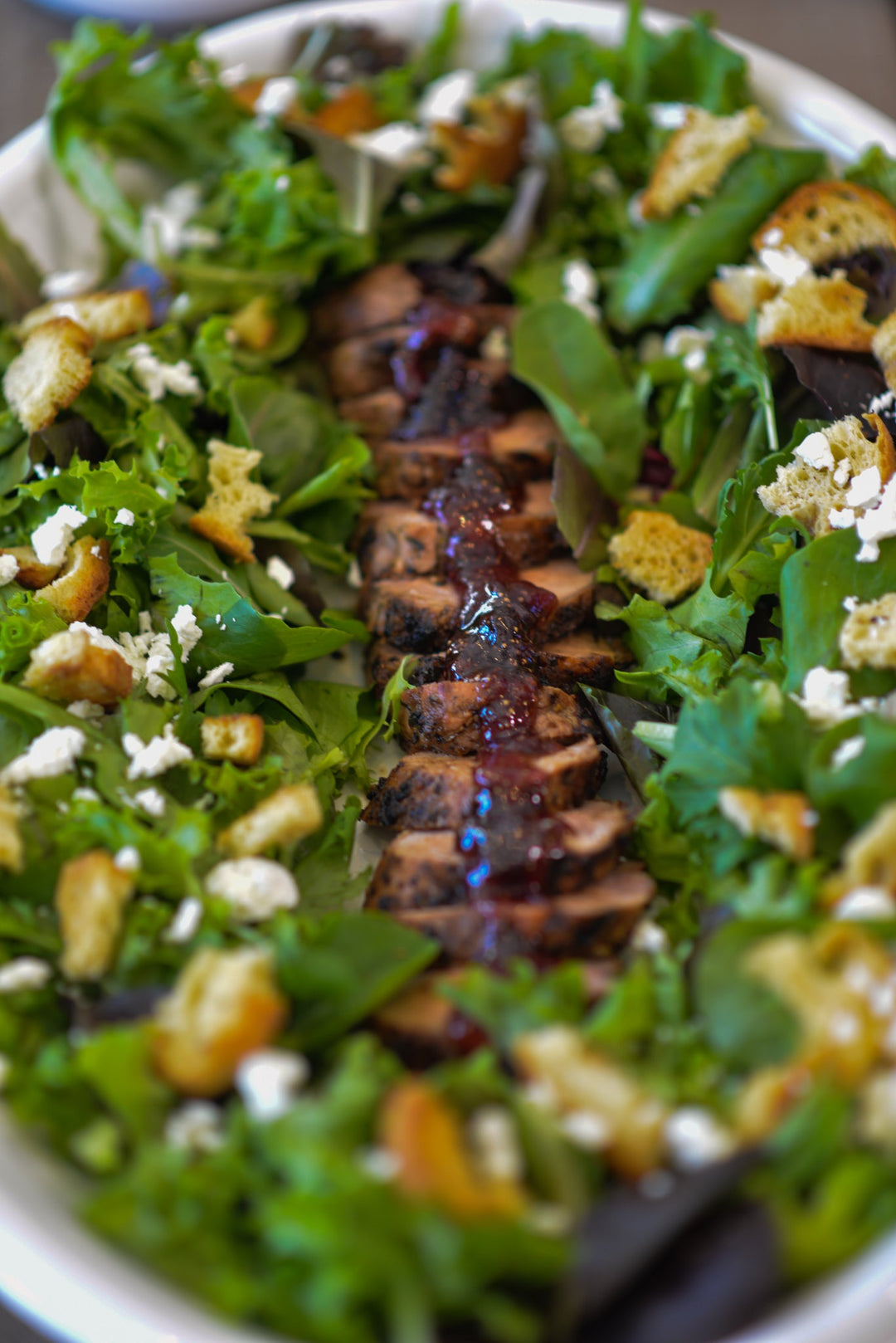 Lemon Garlic Pork Tenderloin with Fig Jam, Greens, Goat Cheese & Crostini
